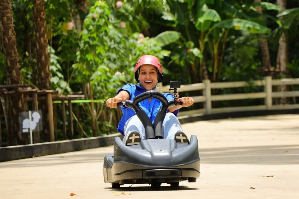 Luge riders on the Hanuman Luge track, included with World C+