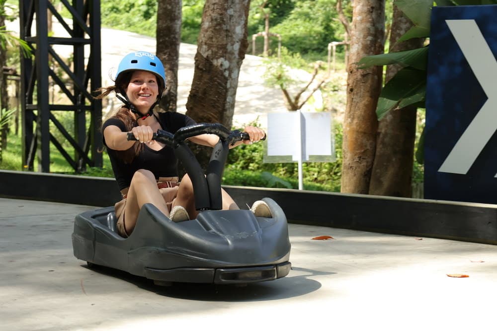 Luge riders on the Hanuman Luge track, included with World D+
